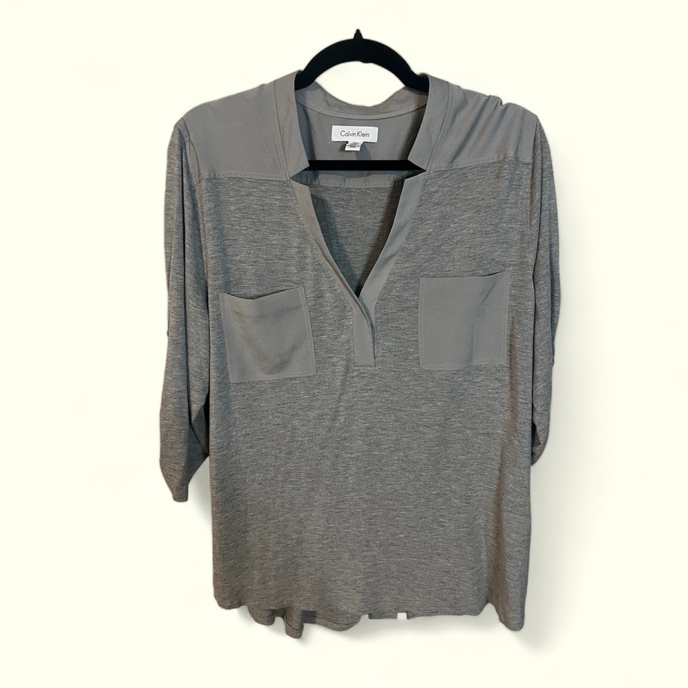 A Calvin Klein gray top in size extra large